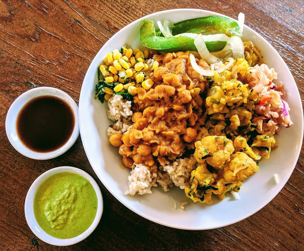 NaanStop signature dishes Chicken Tikka Masala Rice BowlPaneer Naan WrapSamosas